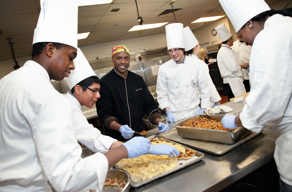 Marvin Woods surrounded by students