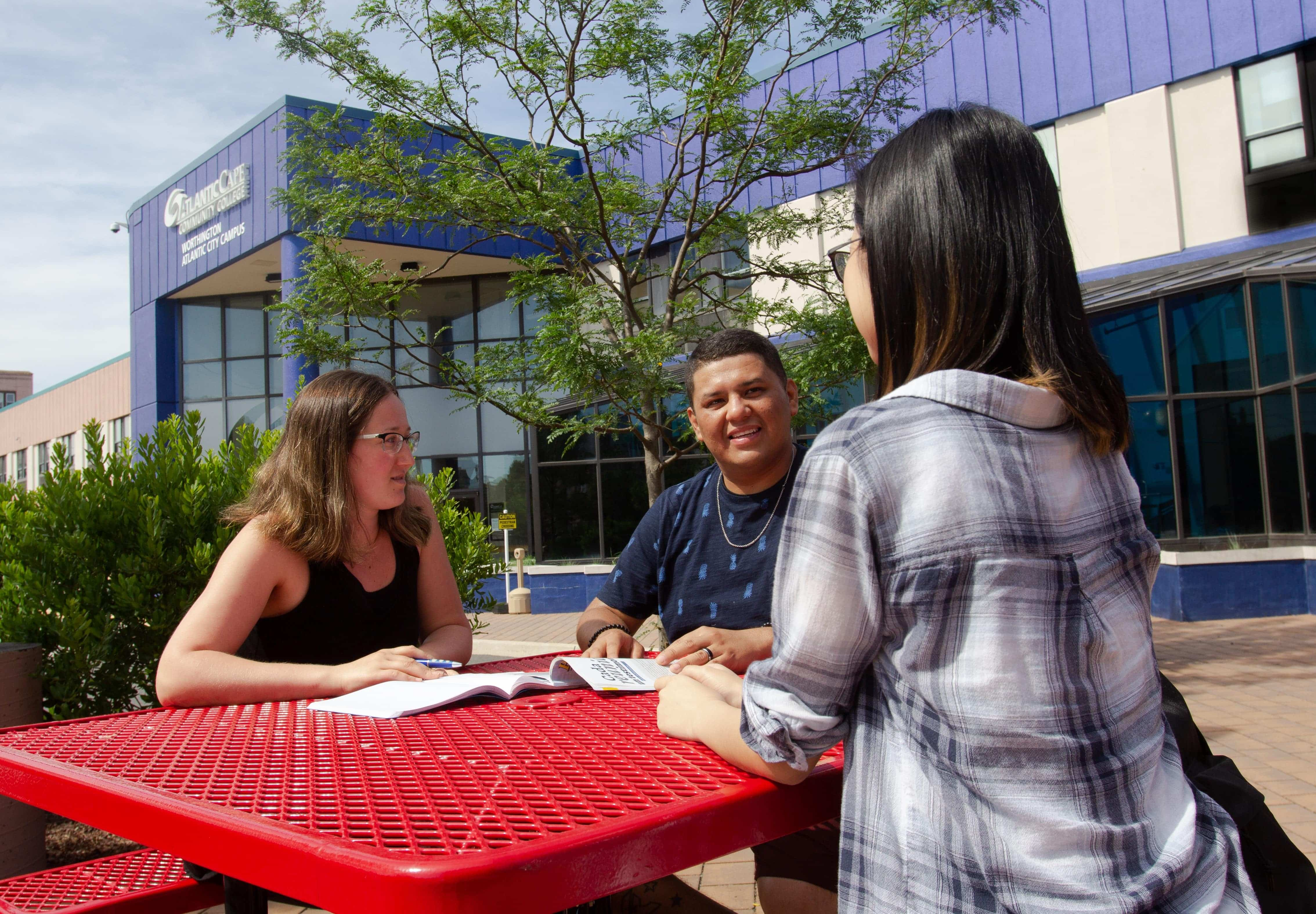 pictures of students in front of AC Campus